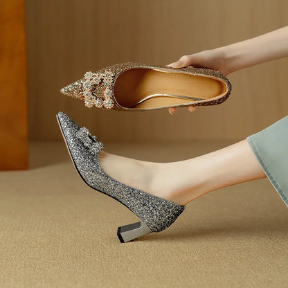 Gold glitter pointed-toe pumps with bow rhinestone detail and slim block heel