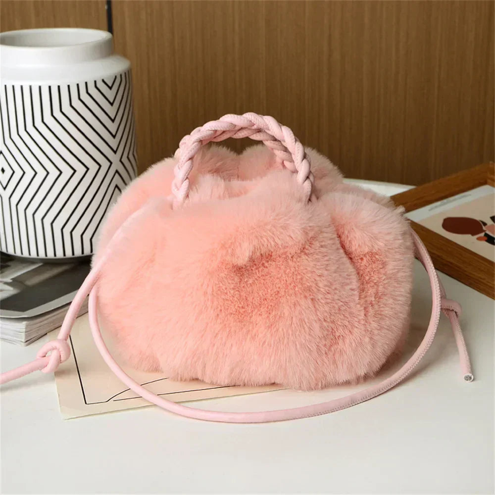 Pink plush pumpkin shoulder tote with braided handle and long rope strap