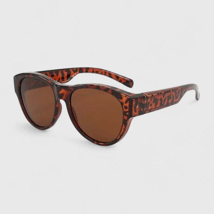 Sunglasses with tortoise-pattern frame and brown lenses, profile view