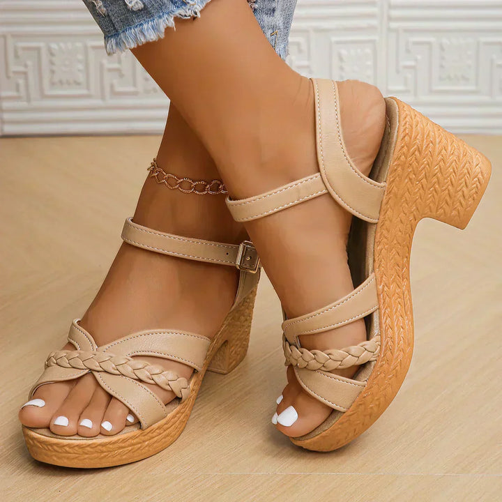 Beige strappy platform sandals with braided front straps and ankle strap with buckle