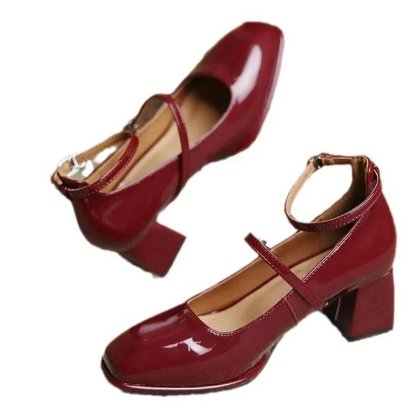 Wine red ankle-strap pumps with Mary Jane strap and block heel, patent look