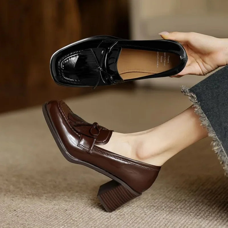 Brown and black loafer pump shoes with tassel detail and block heels
