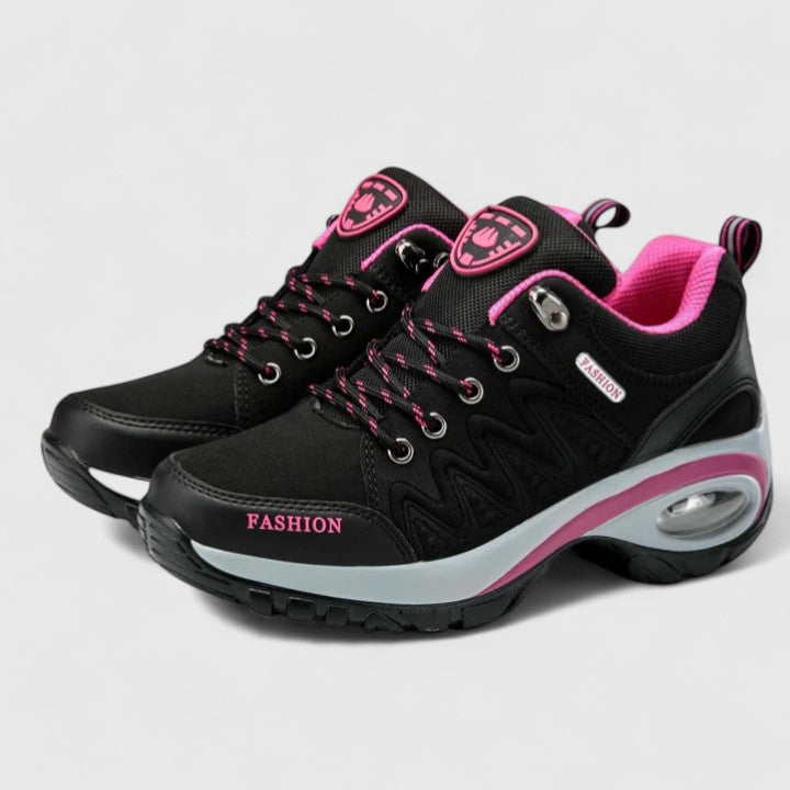 Novira women’s sport shoes, black upper with pink accents and cushioned white midsole