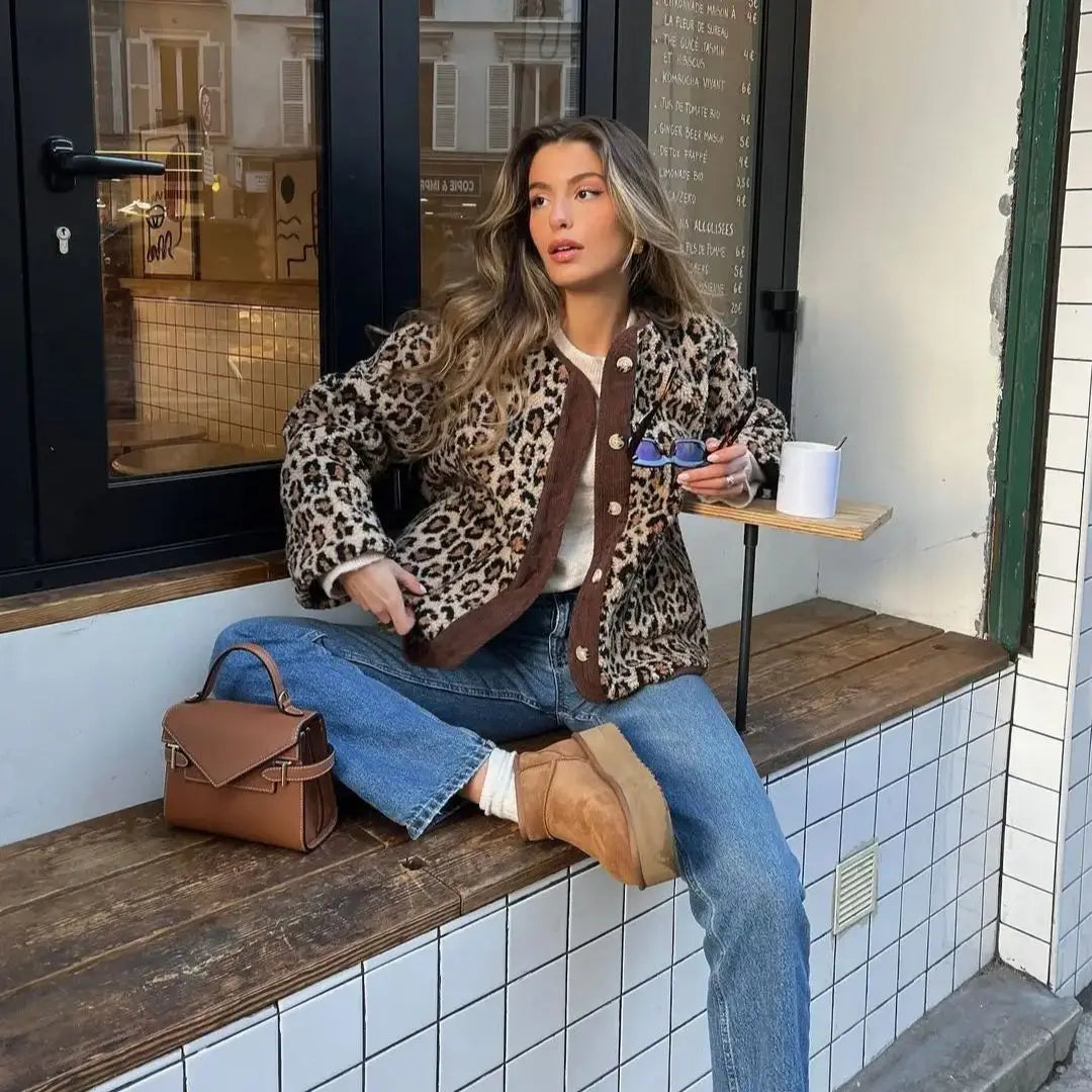 Leopard print cardigan with front button placket, long sleeves, and relaxed fit
