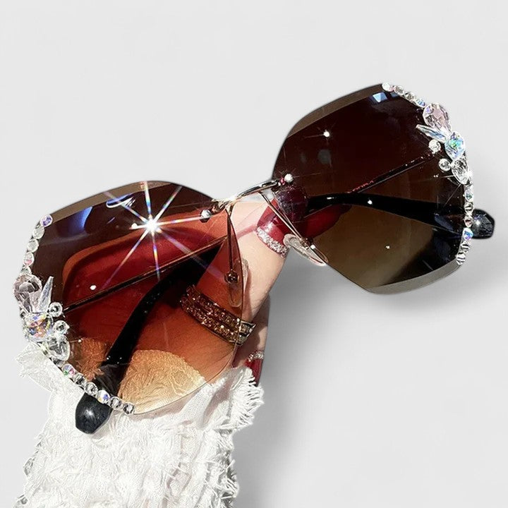 Jeweled sunglasses with rhinestone trim and brown gradient lenses
