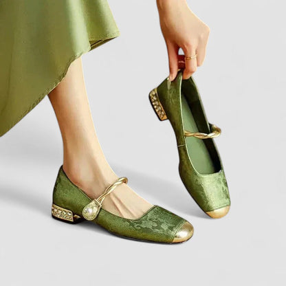 Green orthopedic Mary Jane shoes with gold bow and decorative strap buckle