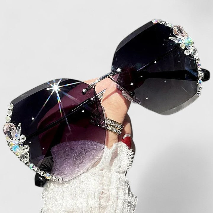 Jeweled sunglasses with crystal-studded frame and dark purple gradient lenses