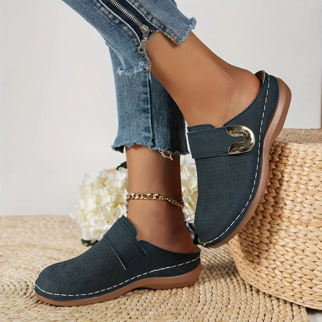 Navy blue slip-on wedge sandals with side strap and gold-tone buckle