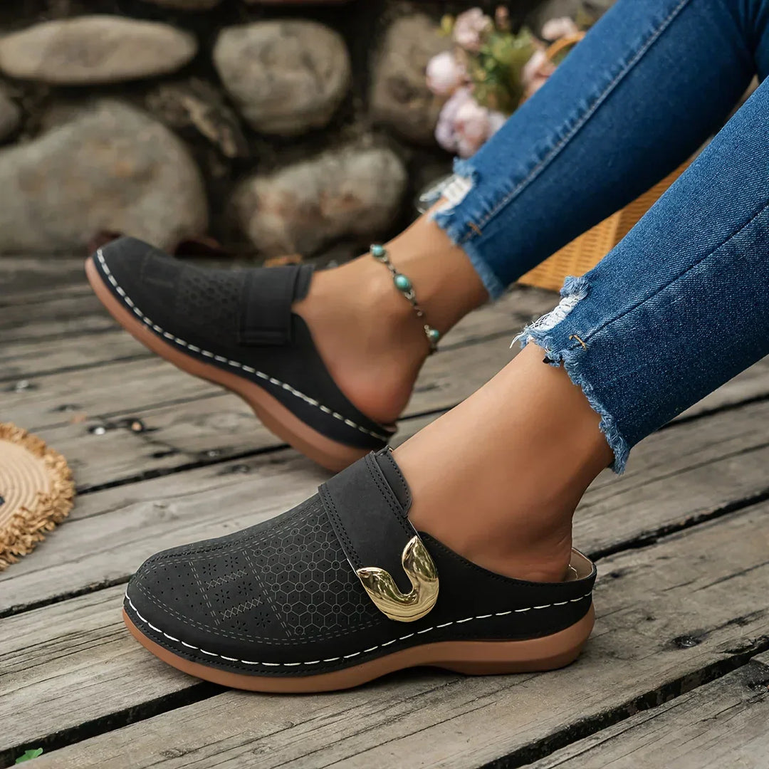 Black perforated wedge sandals with side strap and gold-tone buckle detail