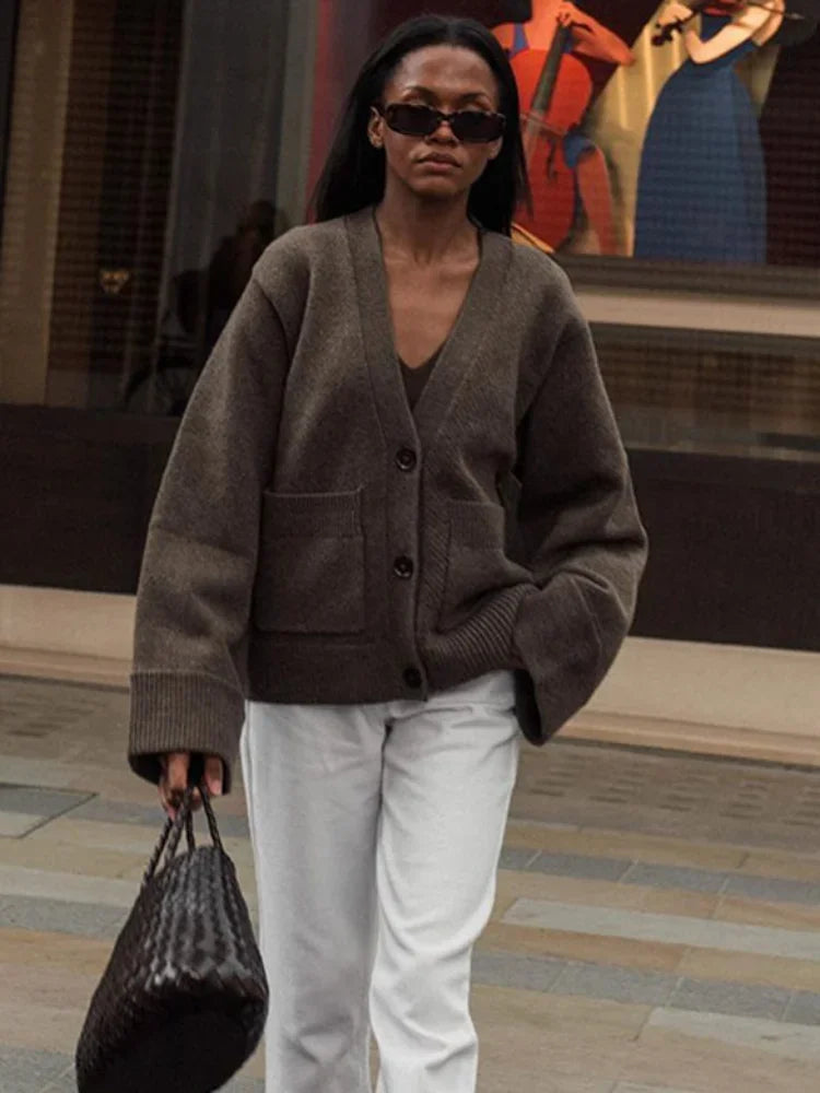 Brown V-neck knit cardigan with button front and patch pockets