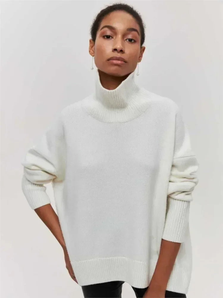 White turtleneck sweater with long sleeves and ribbed collar and cuffs