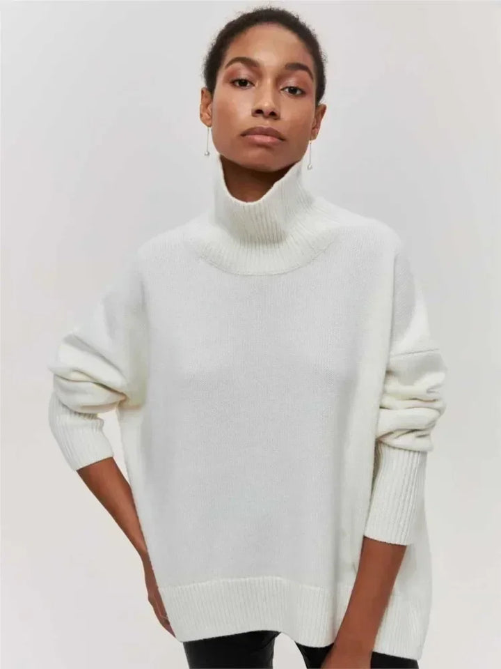 White turtleneck sweater with long sleeves and ribbed collar and cuffs