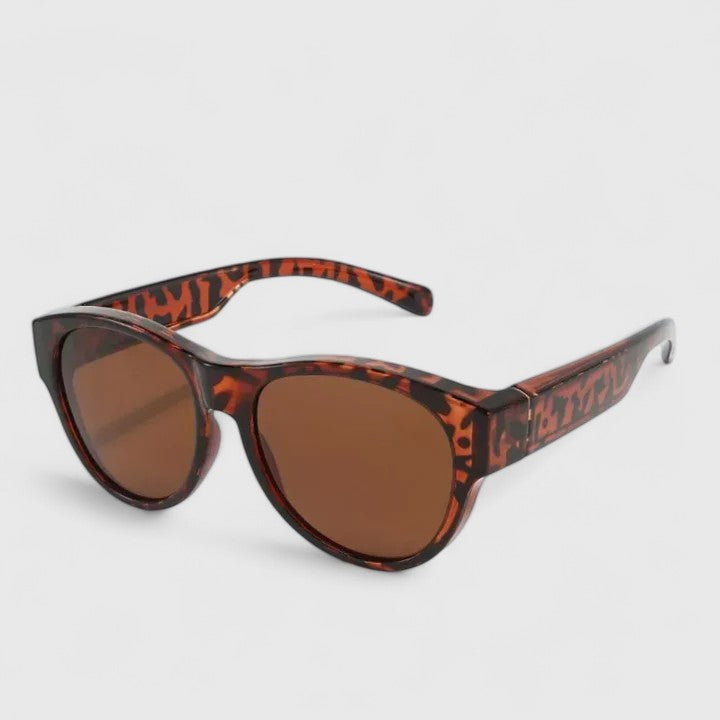 Sunglasses with tortoise-pattern frame and brown lenses, angled view