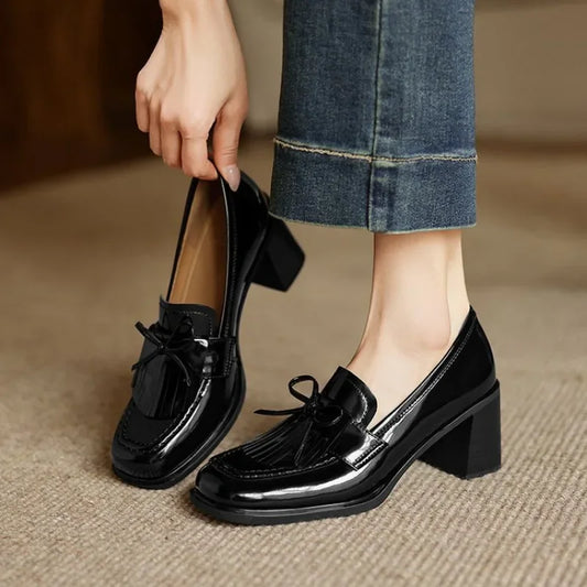 Black loafer pumps with tassel bow detail and chunky block heel