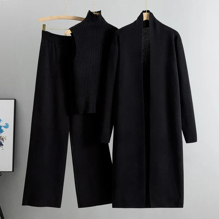 Black three-piece set: ribbed sleeveless turtleneck top, wide-leg pants, long cardigan