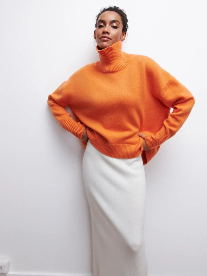 Orange turtleneck sweater with chunky ribbed collar and cuffs