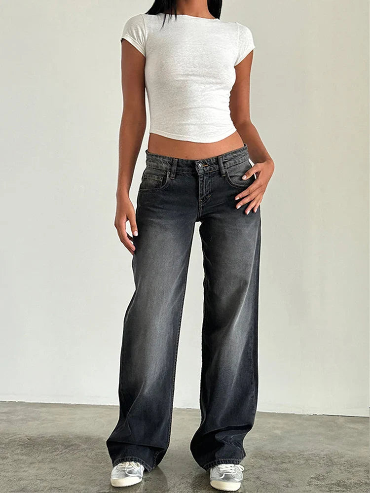 Dark gray vintage baggy jeans with high waist, belt loops, button fly, and relaxed wide legs.