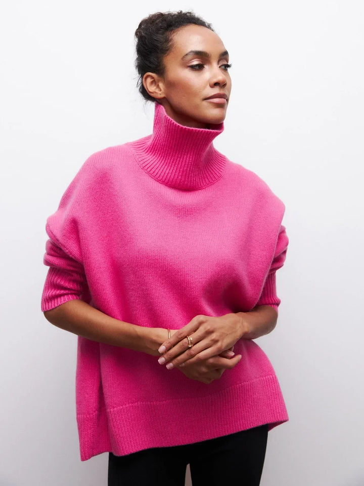 Bright pink turtleneck sweater with long sleeves and ribbed collar and hem