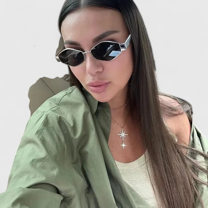 Sunglasses with silver-tone angular frames and dark lenses, faceted temples