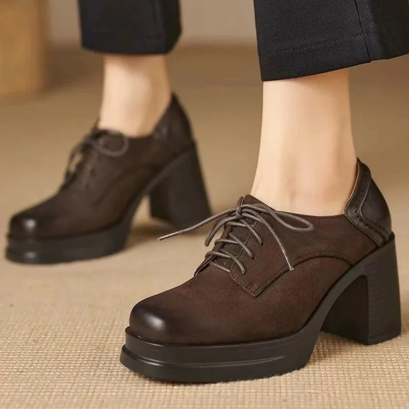 Brown lace-up pumps with chunky block heel and padded ankle collar