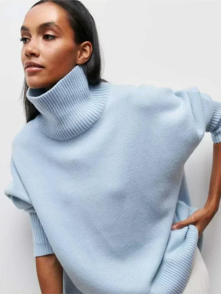 Light blue turtleneck sweater with long sleeves and ribbed collar and cuffs
