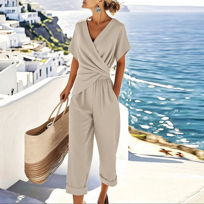 Cream wrap-front two-piece set with draped top and cropped trousers, short sleeves
