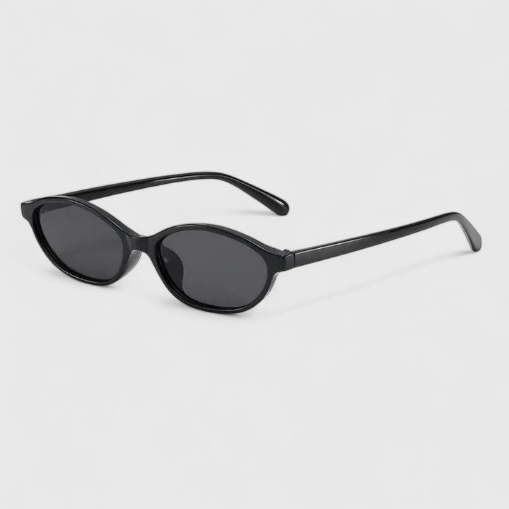 Sunglasses with black frames and dark gray lenses, rounded cat-eye style