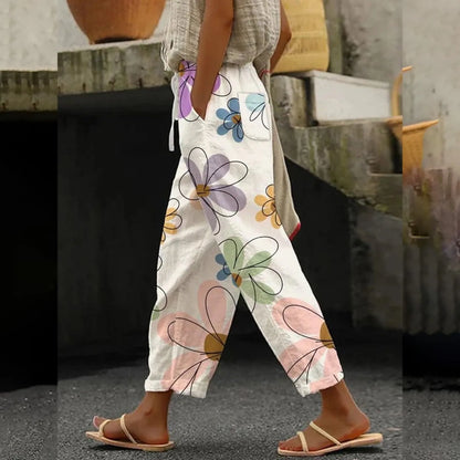 Women's summer pants, white with large colorful flower print, relaxed full-length fit