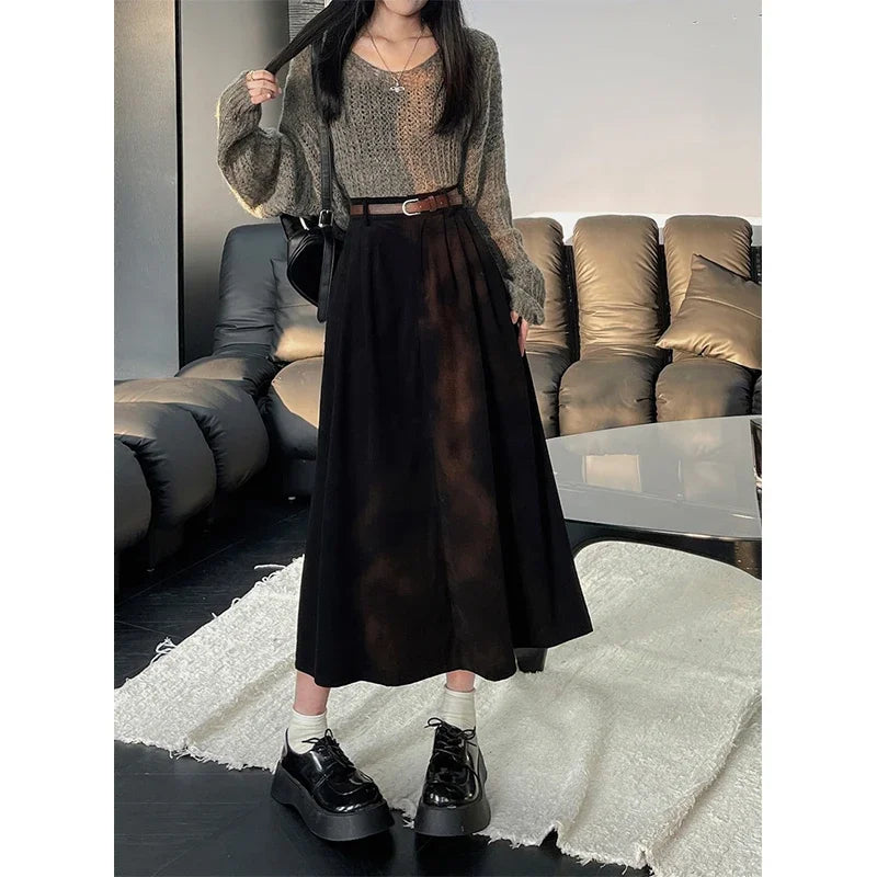 Black corduroy midi skirt with wide belt and gathered waist pleats
