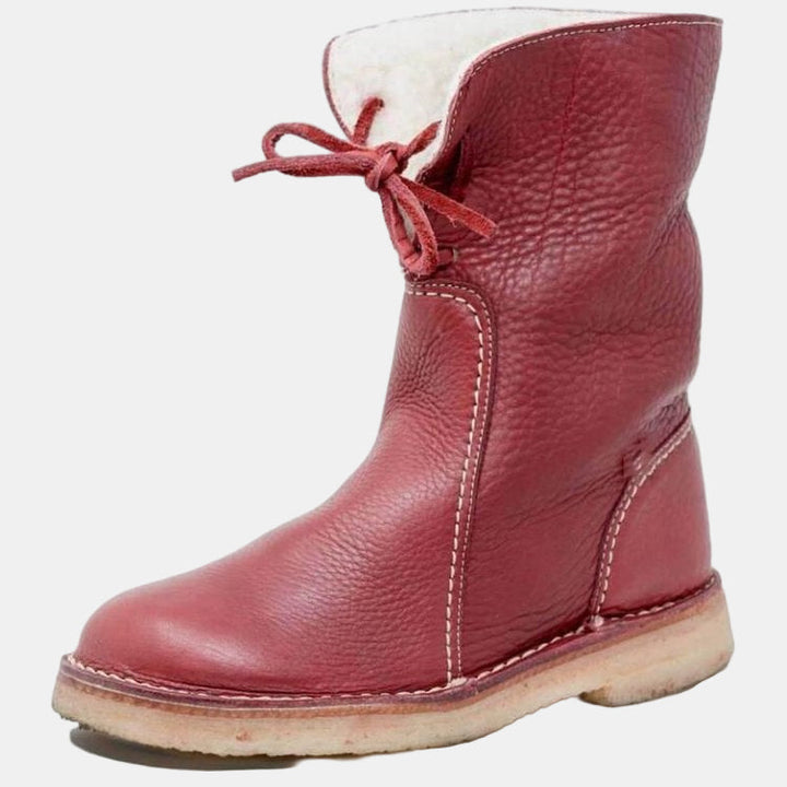 Red winter boots with lace-up ties, padded collar and stitched side panel