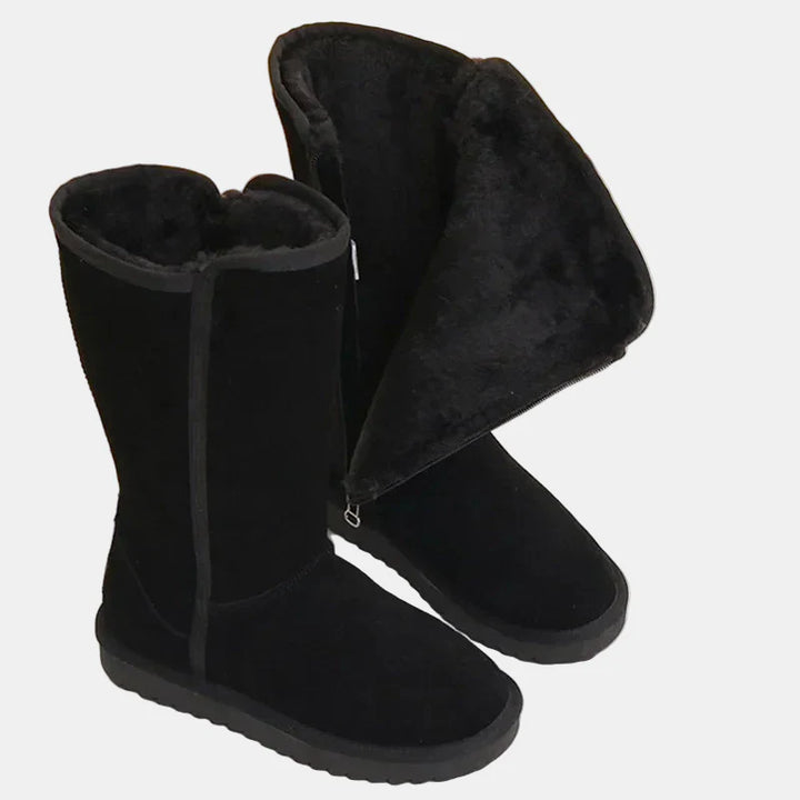 Black velvet knee-high boots with side zipper, plush collar, and thick sole