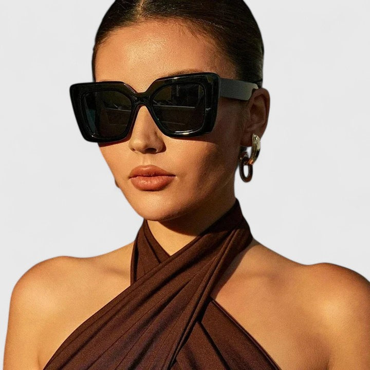 Black square sunglasses with dark tinted lenses and thick frame