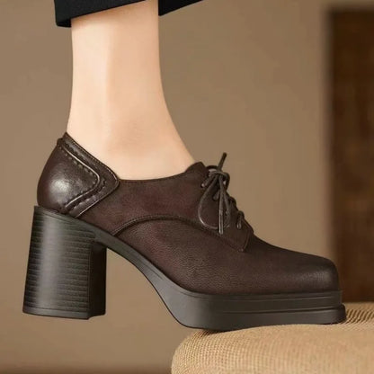 Brown lace-up pumps with chunky block heel and rounded toe