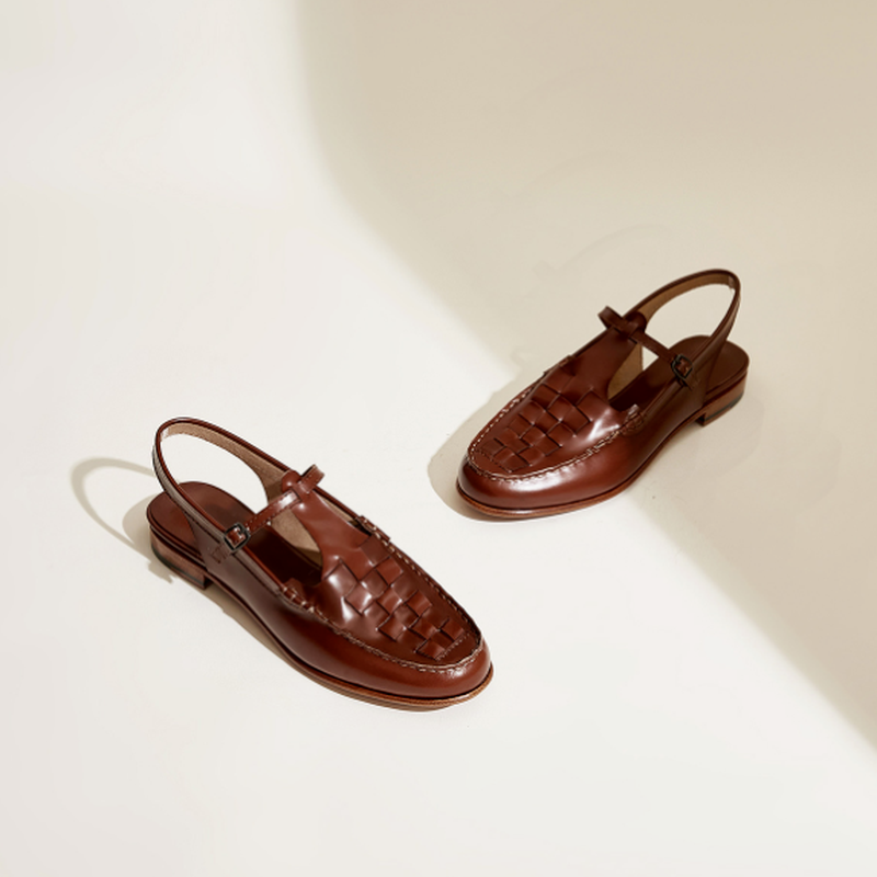 Brown woven charm sandals, basket-weave upper with T-strap and metal buckle, low heel