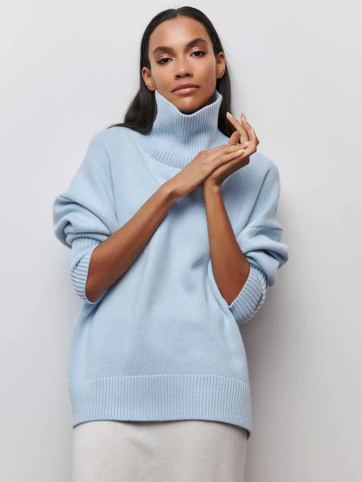 Light blue turtleneck sweater with high ribbed neck and long sleeves