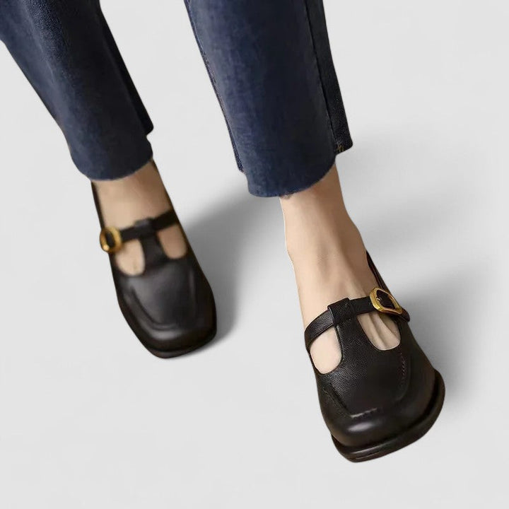 Black T-strap Mary Jane shoes with gold-tone buckle and low block heel