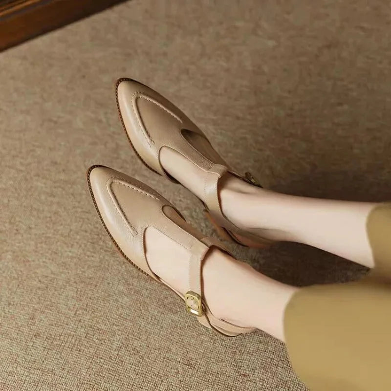 Cream buckle loafers with gold-tone buckle and side strap, low block heel