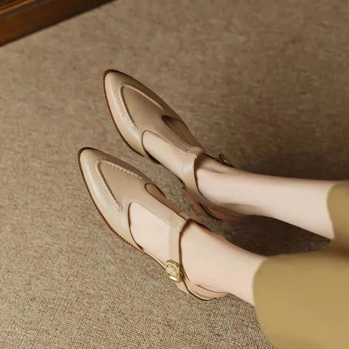 Cream buckle loafers with gold-tone buckle and side strap, low block heel