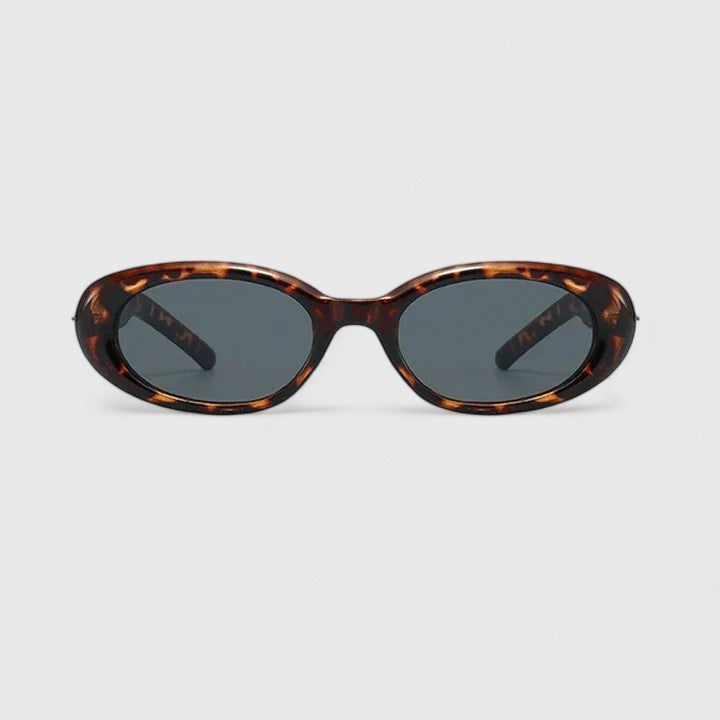 Tortoise oval sunglasses with dark lenses and curved bridge