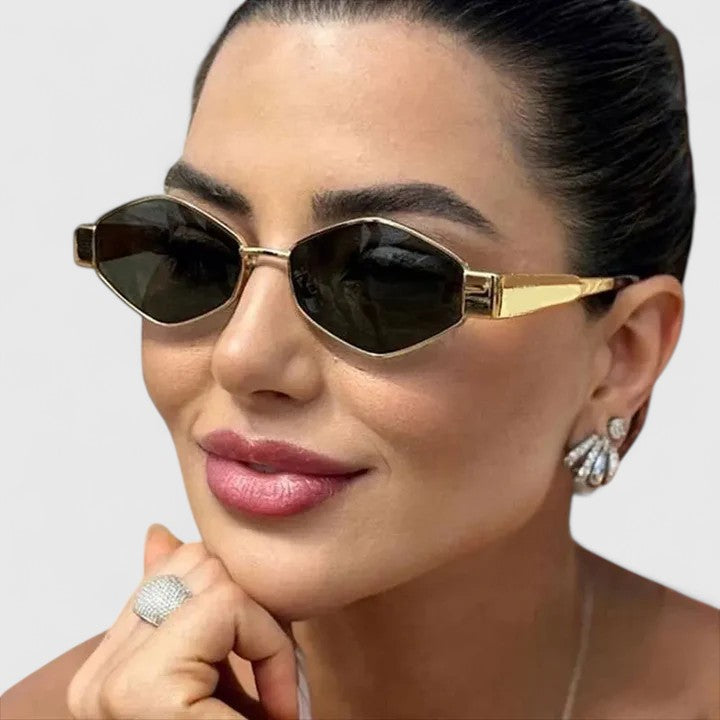 Gold-tone cat-eye sunglasses with dark lenses and slim metal bridge