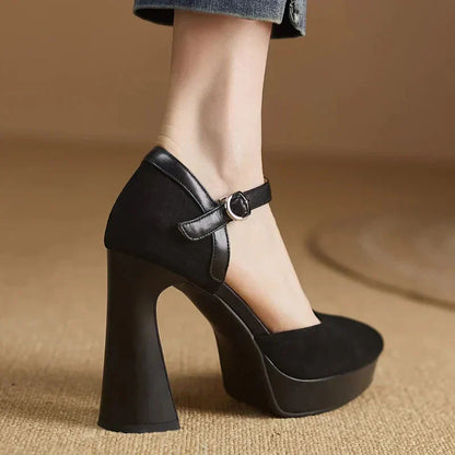 Black ankle-strap pumps with pointed toe and chunky block heel