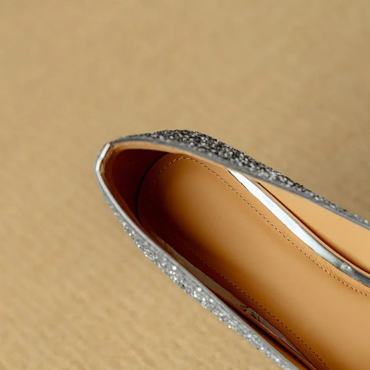 Silver glitter pointed-toe pump with open topline and tan leather lining