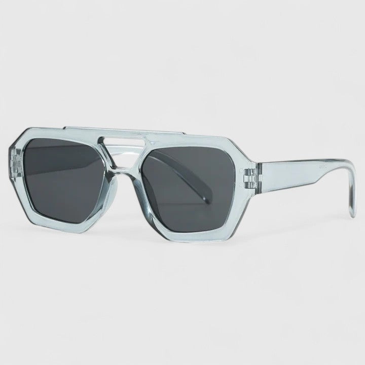 Clear light-blue sunglasses with dark lenses and silver bridge detail