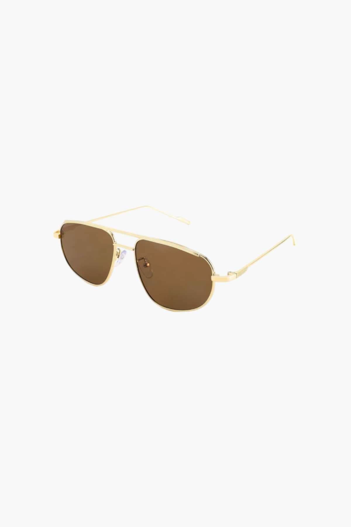 Gold-tone aviator sunglasses with brown-tinted lenses in angled view