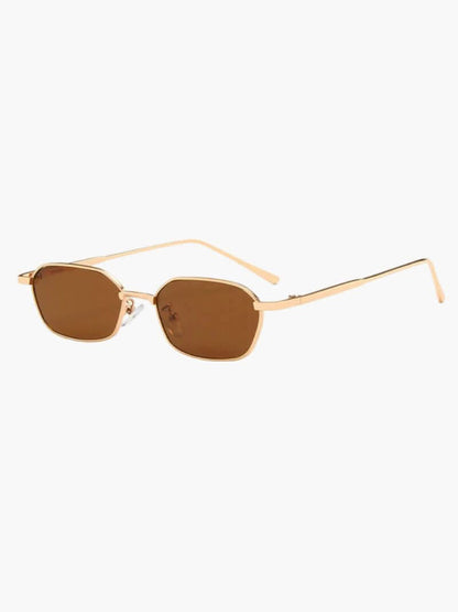 Gold-framed sunglasses with brown tinted lenses and clear gold temples