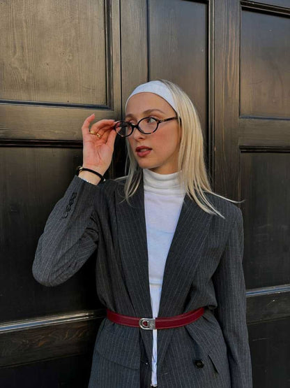 Reading glasses with black round frames and short angled temples