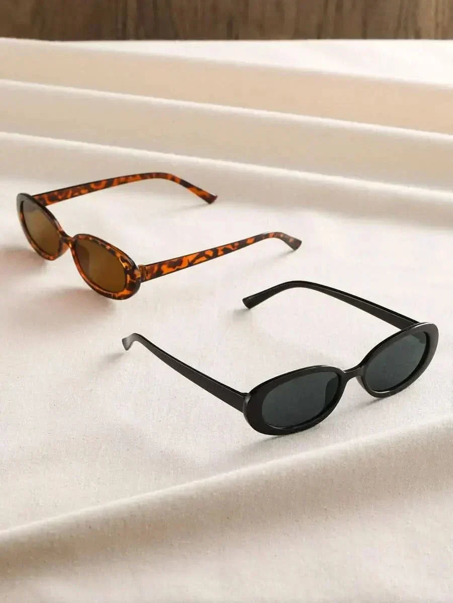 Tortoiseshell and black oval sunglasses, angled views, dark lenses