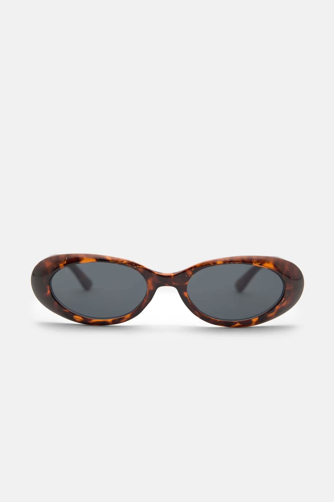 Tortoiseshell oval sunglasses with dark brown lenses