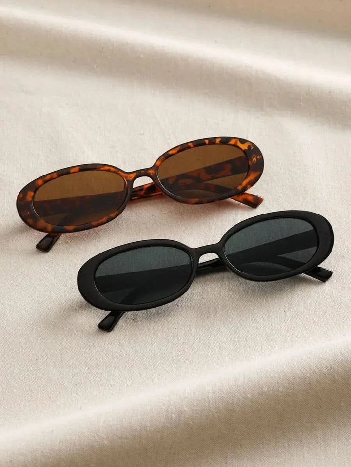Set of tortoiseshell and black oval sunglasses with dark lenses