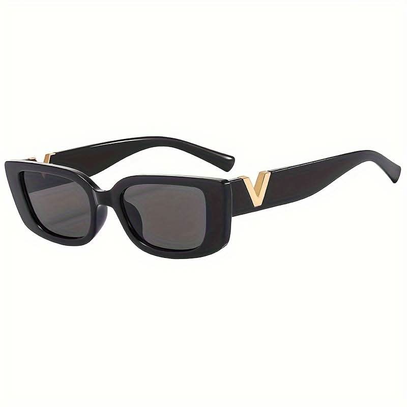 Black sunglasses with dark lenses and gold V metal detail, 3/4 angle.